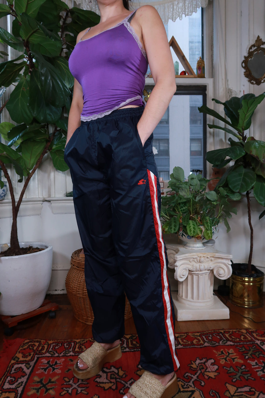 Vintage Y2K Navy Blue Starter track pants for women by Elektra Vintage, featuring sporty design and elastic waistband.
