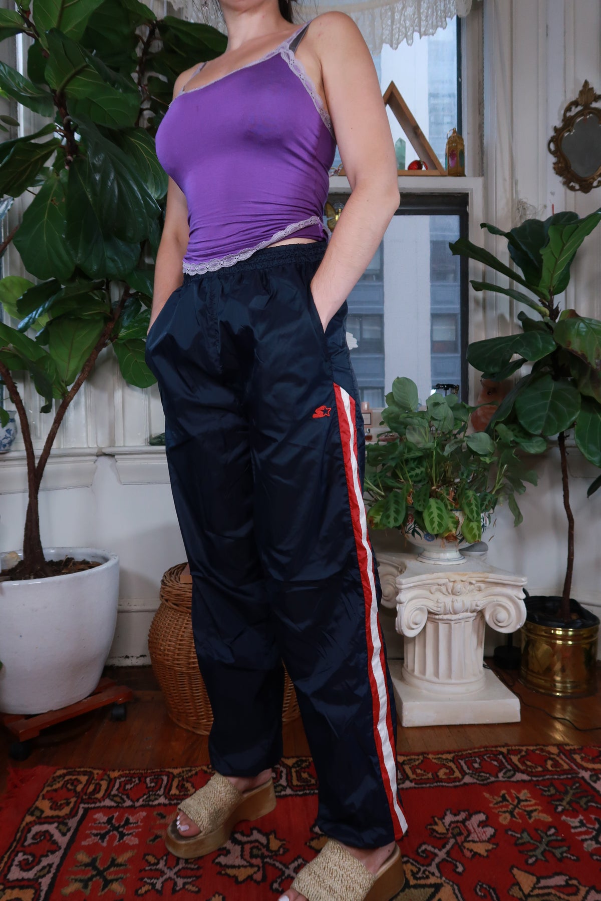 Vintage Y2K Navy Blue Starter track pants for women by Elektra Vintage, featuring sporty design and elastic waistband.