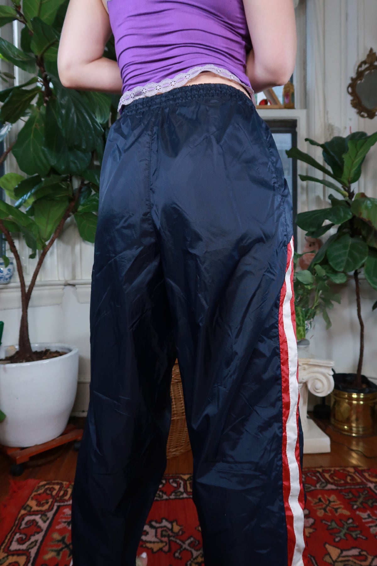Vintage Y2K Navy Blue Starter track pants for women by Elektra Vintage, featuring an athletic fit and elastic waistband.