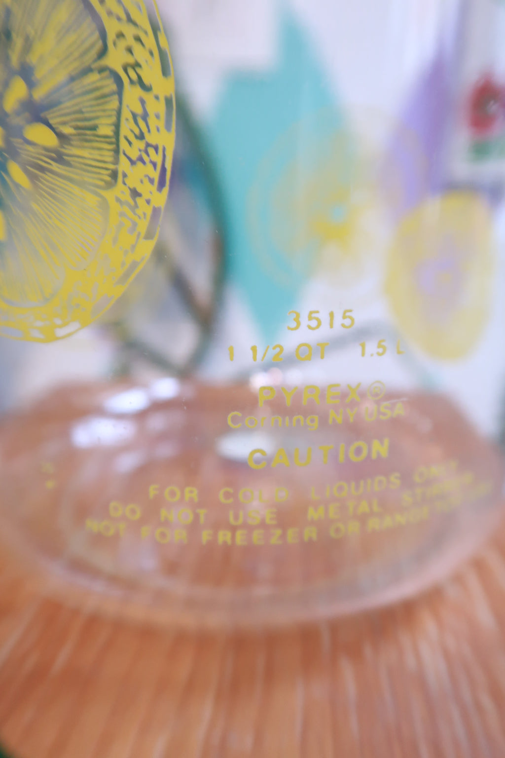 Vintage lemon print glass pitcher with yellow lid by Elektra Vintage, featuring retro citrus juice carafe design.