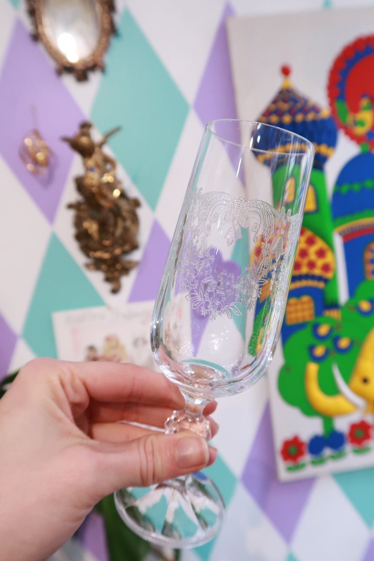 Vintage etched crystal champagne flutes with faceted stems and floral design by Elektra Vintage, showcasing elegant crystal stemware.
