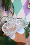 Set of vintage Hobnail milk glass pedestal dessert bowls with opalescent footed design, perfect for serving sweets or fruit.