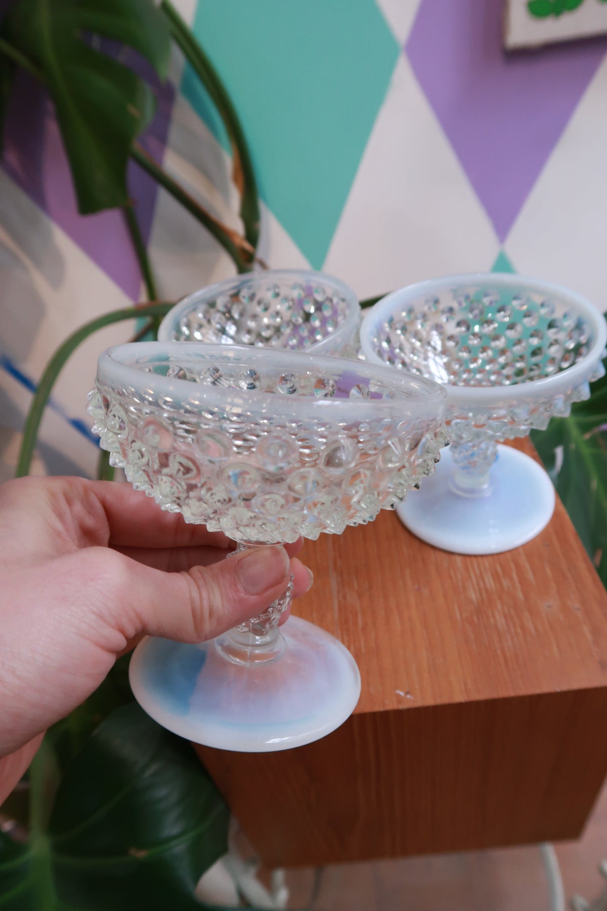 Set of vintage Hobnail milk glass pedestal dessert bowls with opalescent finish and footed design by Elektra Vintage.