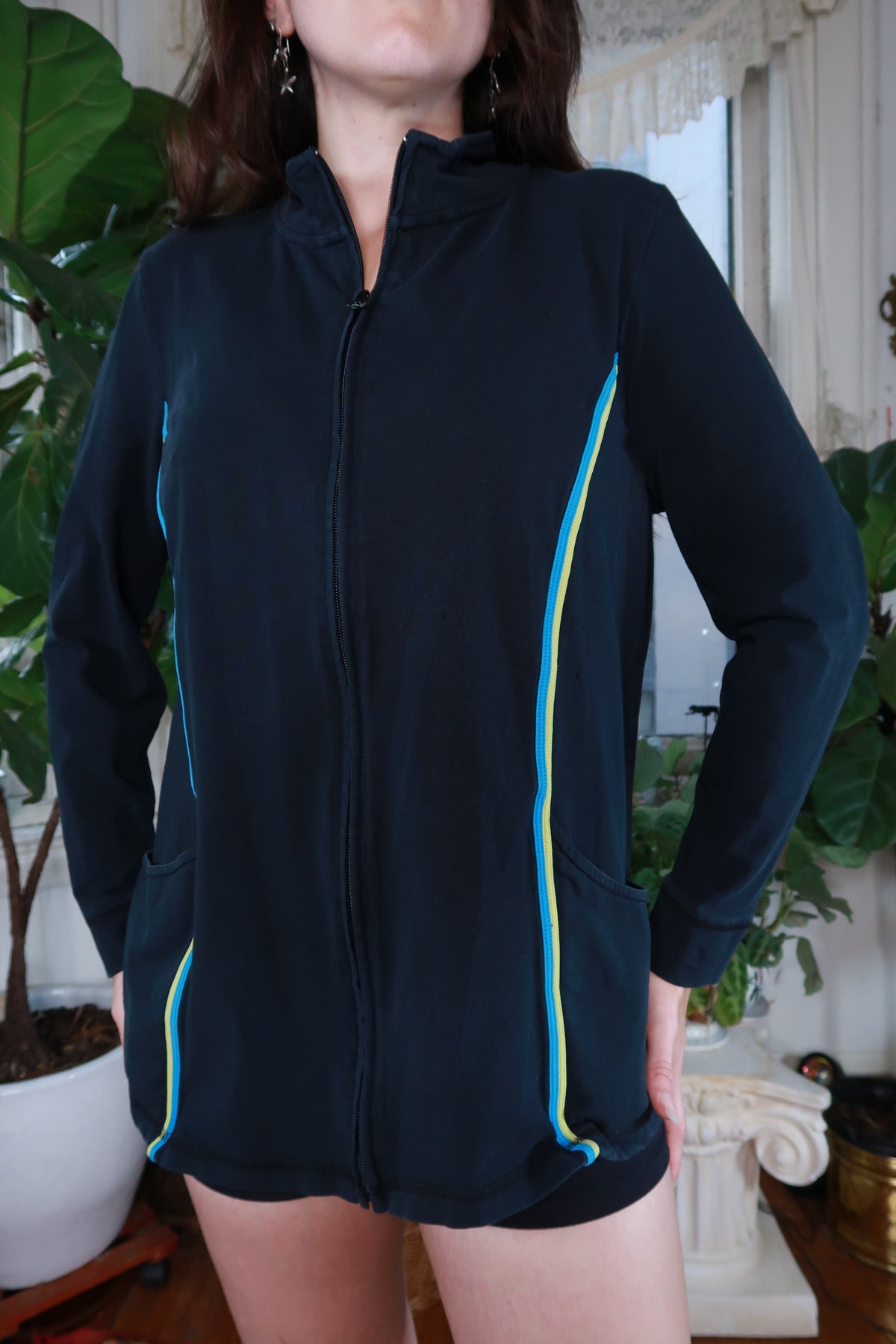Women's navy blue zip-up track jacket by Elektra Vintage, vintage Y2K style, shown on a hanger.