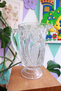Elektra Vintage pressed cut glass pitcher with starburst and fan pattern, pedestal design, perfect for serving water or beverages.