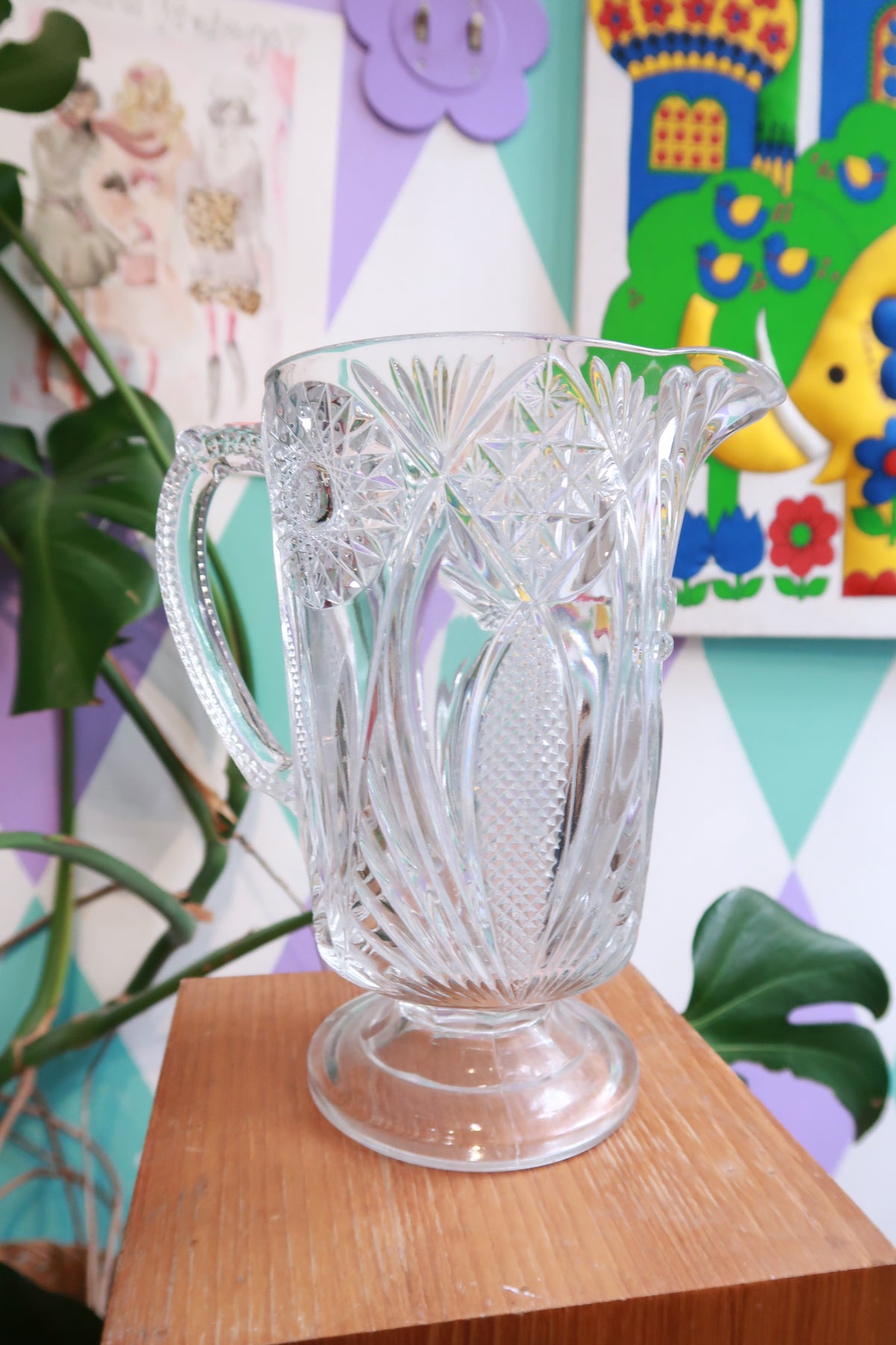 Elektra Vintage pressed cut glass pitcher with starburst and fan pattern, pedestal design, perfect for serving water or beverages.