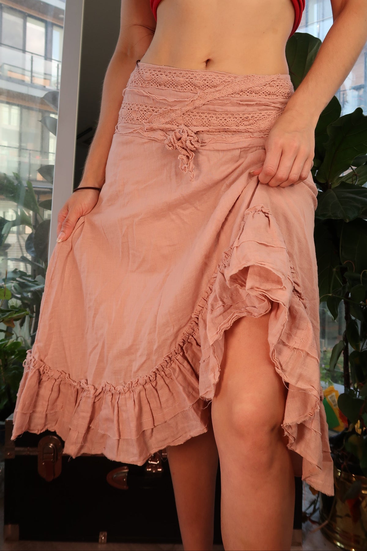 Vintage Elektra Vintage dusty rose boho skirt with ruffle hem and crochet waist, showcasing a flowy, bohemian style.