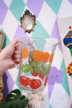 Load image into Gallery viewer, Vintage glass pitcher with red tomato and orange fruit print, retro juice pitcher by Elektra Vintage.
