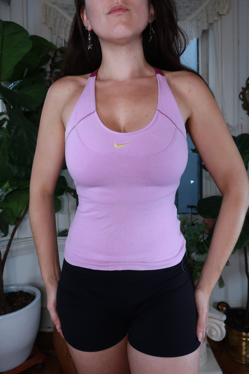 Vintage Y2K Nike lilac racerback tank top for women, featuring a sporty design and Nike logo on the front.