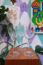 Load image into Gallery viewer, Set of three vintage etched floral wine glasses by Elektra Vintage with frosted flower designs on clear glass stemware.
