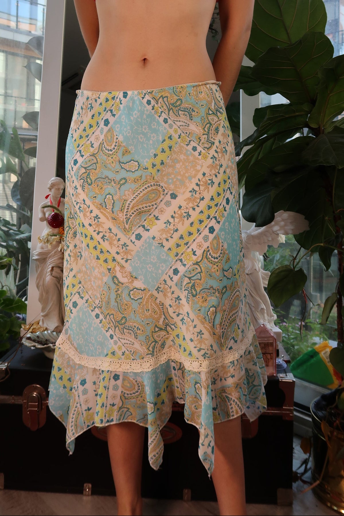 Vintage 2000s patchwork handkerchief hem skirt by Elektra Vintage showing colorful fabric panels and flowing design.
