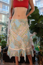 Load image into Gallery viewer, Vintage 2000s patchwork handkerchief hem skirt by Elektra Vintage showing colorful, flowing fabric with patchwork details.
