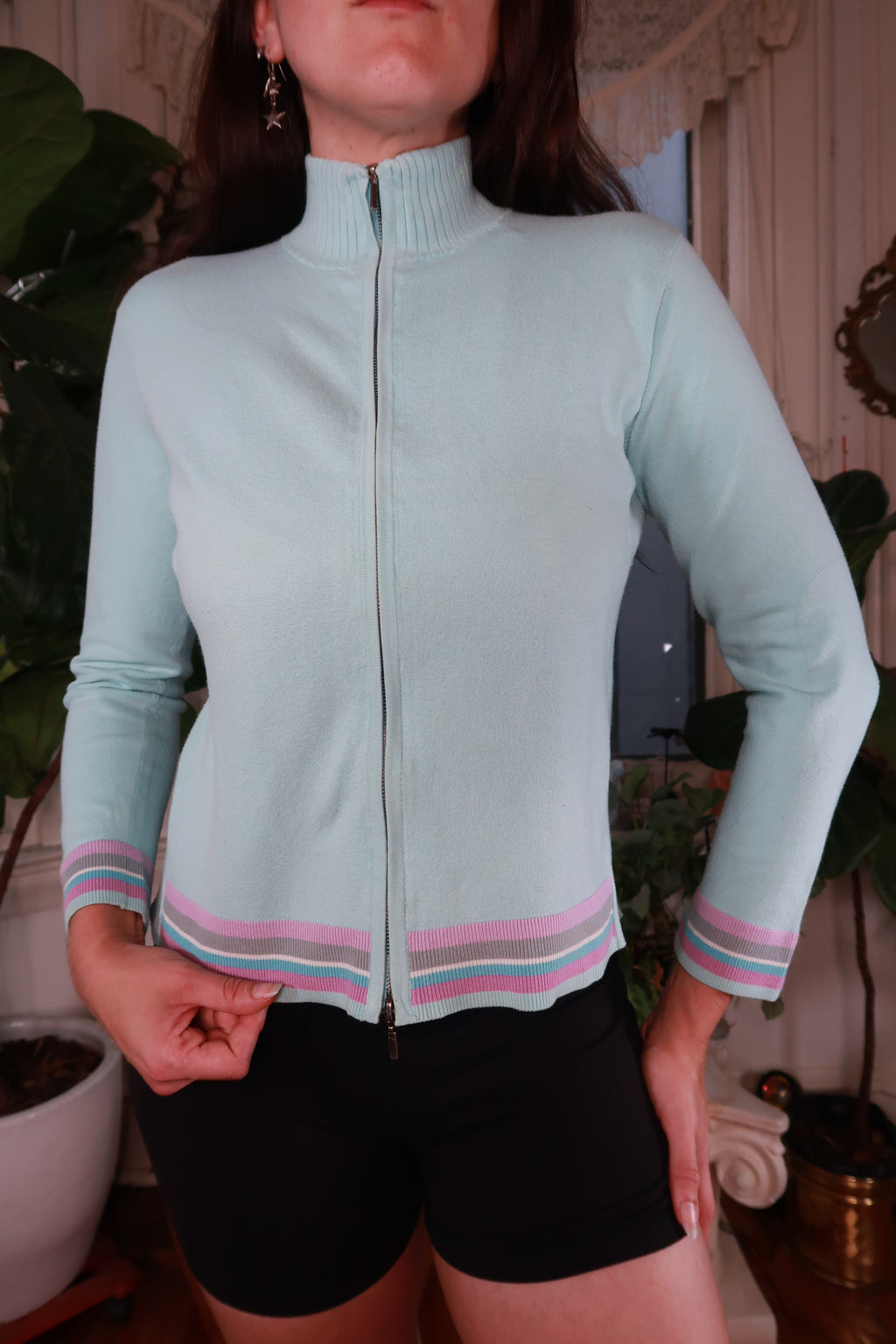 Vintage Y2K pastel blue striped zip-up sweater for women by Elektra Vintage, featuring a cozy knit fabric and casual style.