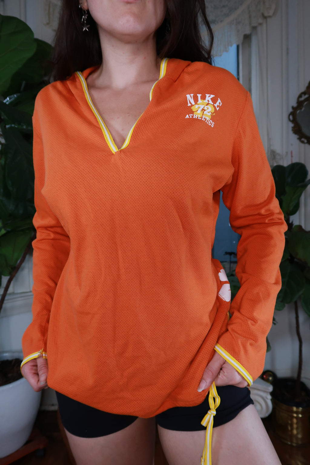 Women's vintage Y2K Nike orange mesh floral hoodie by Elektra Vintage, featuring a vibrant floral pattern and casual fit.