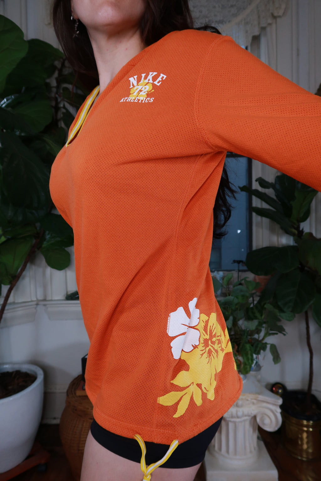 Vintage Y2K Nike orange mesh floral hoodie for women, featuring a stylish floral design and breathable fabric.