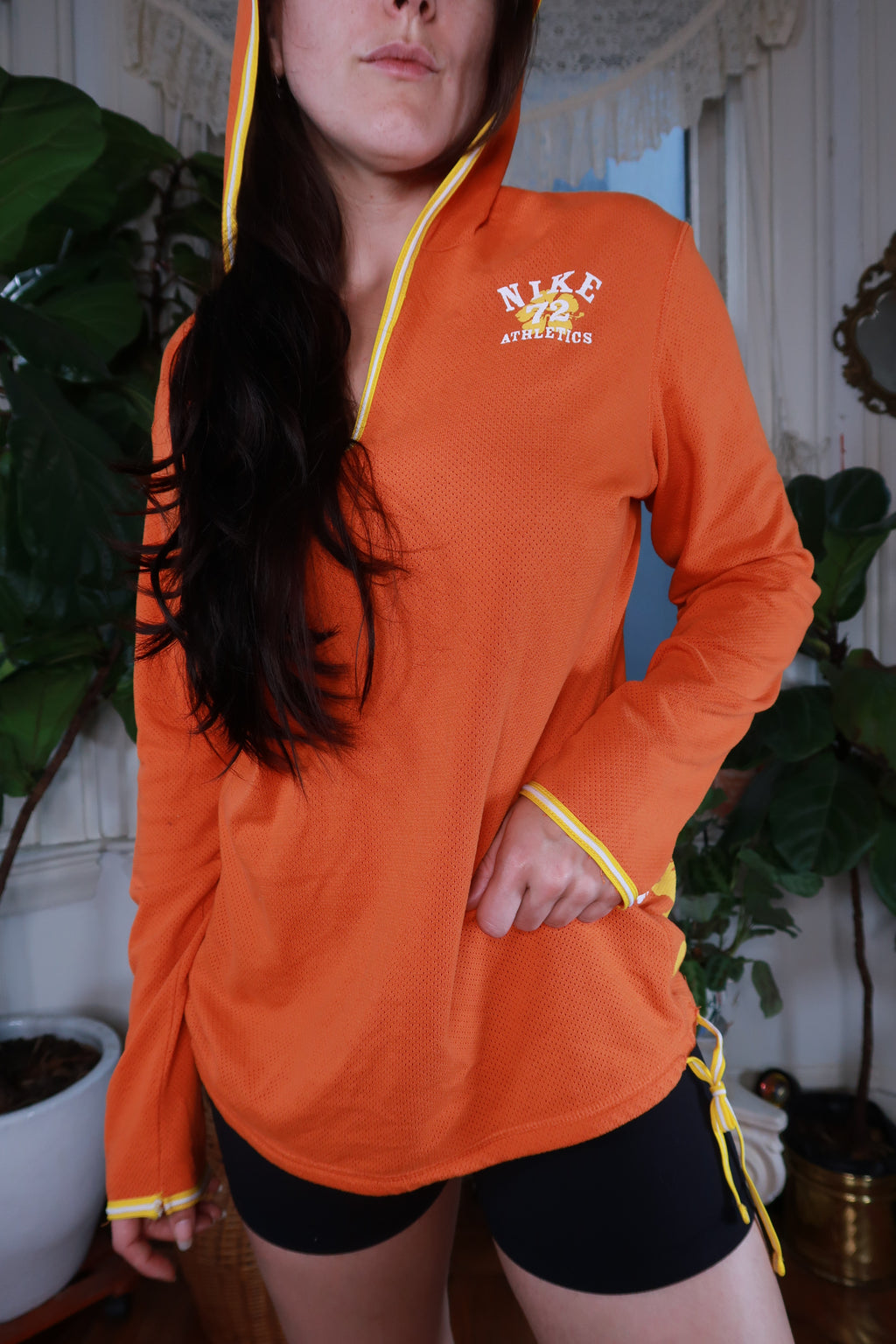 Women's vintage Y2K Nike orange mesh floral hoodie with long sleeves and floral pattern, from Elektra Vintage.