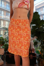 Load image into Gallery viewer, Vintage 2000s GAP orange floral midi skirt from Elektra Vintage, featuring a flowy fabric and vibrant floral pattern.
