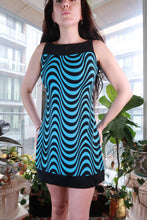 Load image into Gallery viewer, Vintage 2000s blue and black optical print mini dress by Elektra Vintage, featuring a Y2K mod psychedelic shift style.
