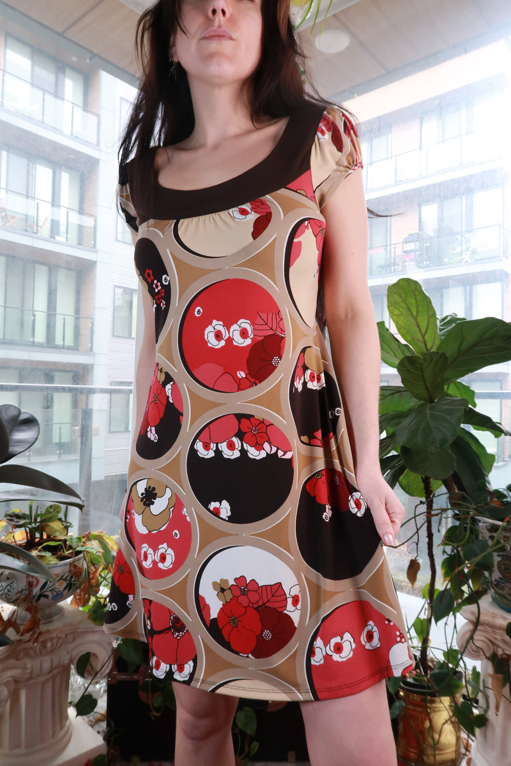 Vintage 2000s Elektra Vintage floral circle print mini dress with Y2K retro graphic A-line silhouette, shown on a mannequin.