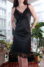 Load image into Gallery viewer, Vintage black satin lace slip dress by Elektra Vintage featuring lace trim and a midi length, perfect for elegant lingerie-inspired style.

