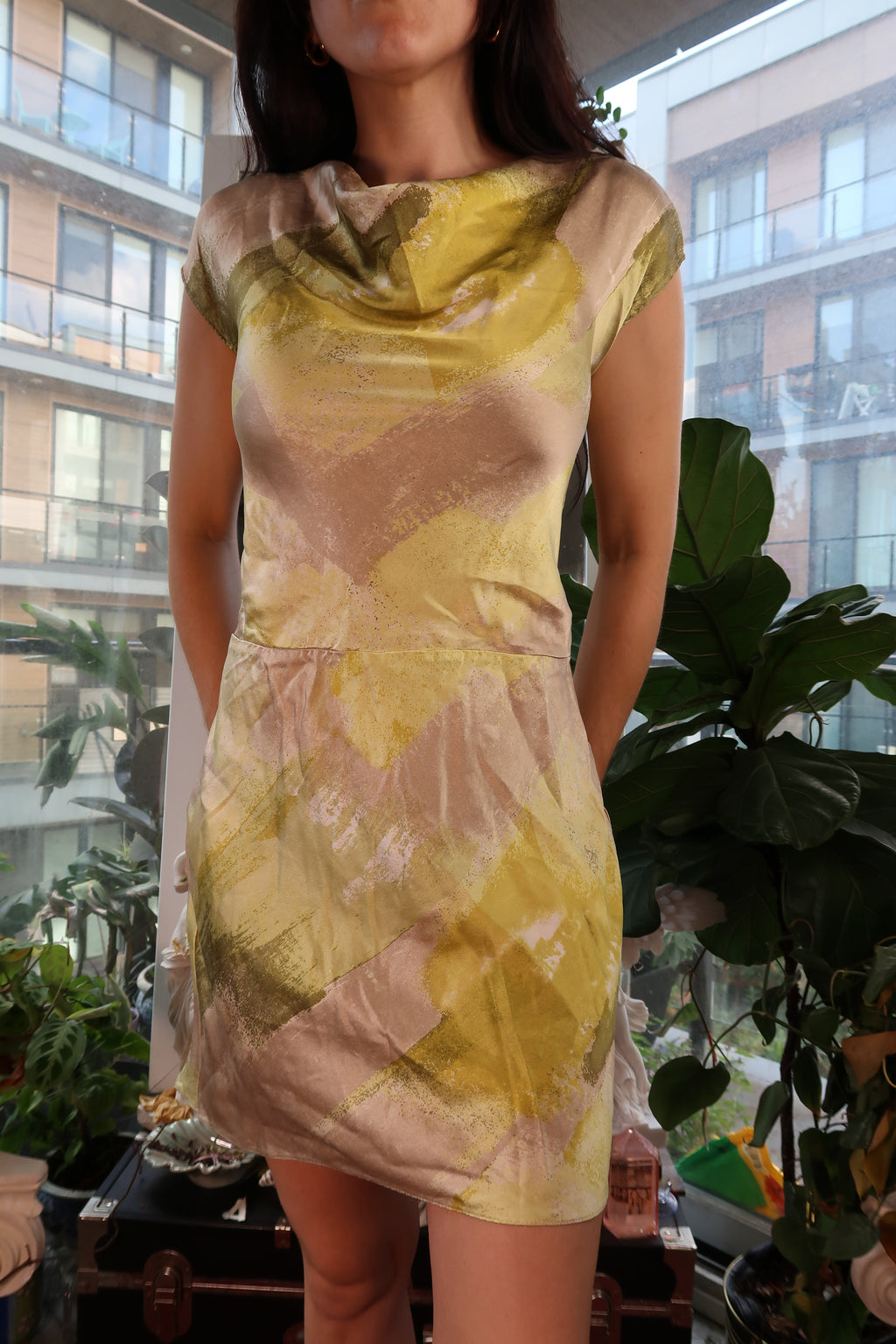 Vintage 2000s Elektra Vintage silk bias cut dress displayed on a hanger, showcasing its flowing fabric and elegant design.
