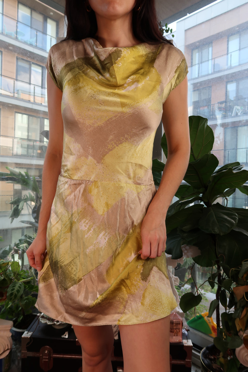 Vintage 2000s Elektra Vintage silk bias cut dress with flowing fabric and elegant silhouette in soft, vibrant colors.