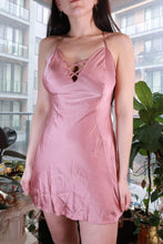 Load image into Gallery viewer, Vintage dusty pink satin slip dress with lace-up front from Elektra Vintage, Y2K-inspired mini dress with a sleek, shiny finish.
