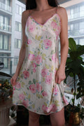 Pink satin slip dress with floral lace trim, vintage 2000s Y2K style mini dress by Elektra Vintage, featuring a rose pattern.