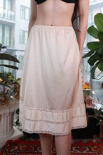 Load image into Gallery viewer, Vintage ivory satin half slip skirt with lace trim, classic midi underskirt by Elektra Vintage, shown with smooth satin fabric and lace details.
