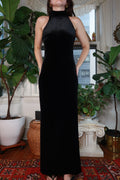 Vintage Ralph Lauren black velvet gown dress displayed on a hanger, showcasing elegant fabric and classic design details.