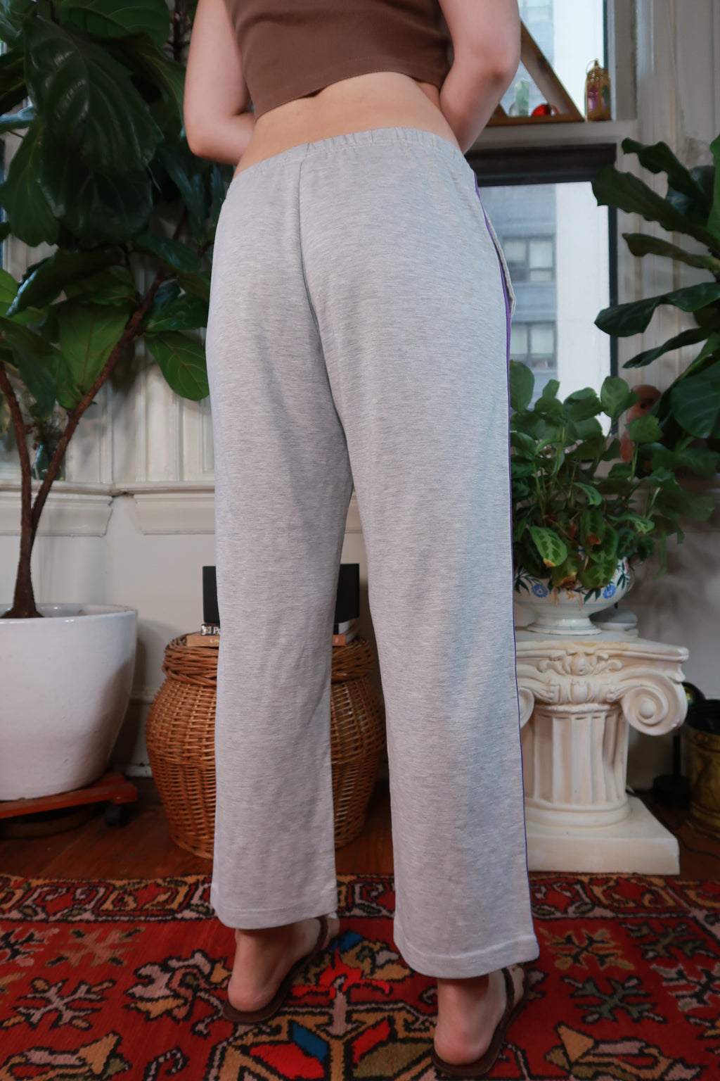 Vintage Y2K gray low rise wide leg track pants for women, featuring a relaxed fit and sporty style from Elektra Vintage.