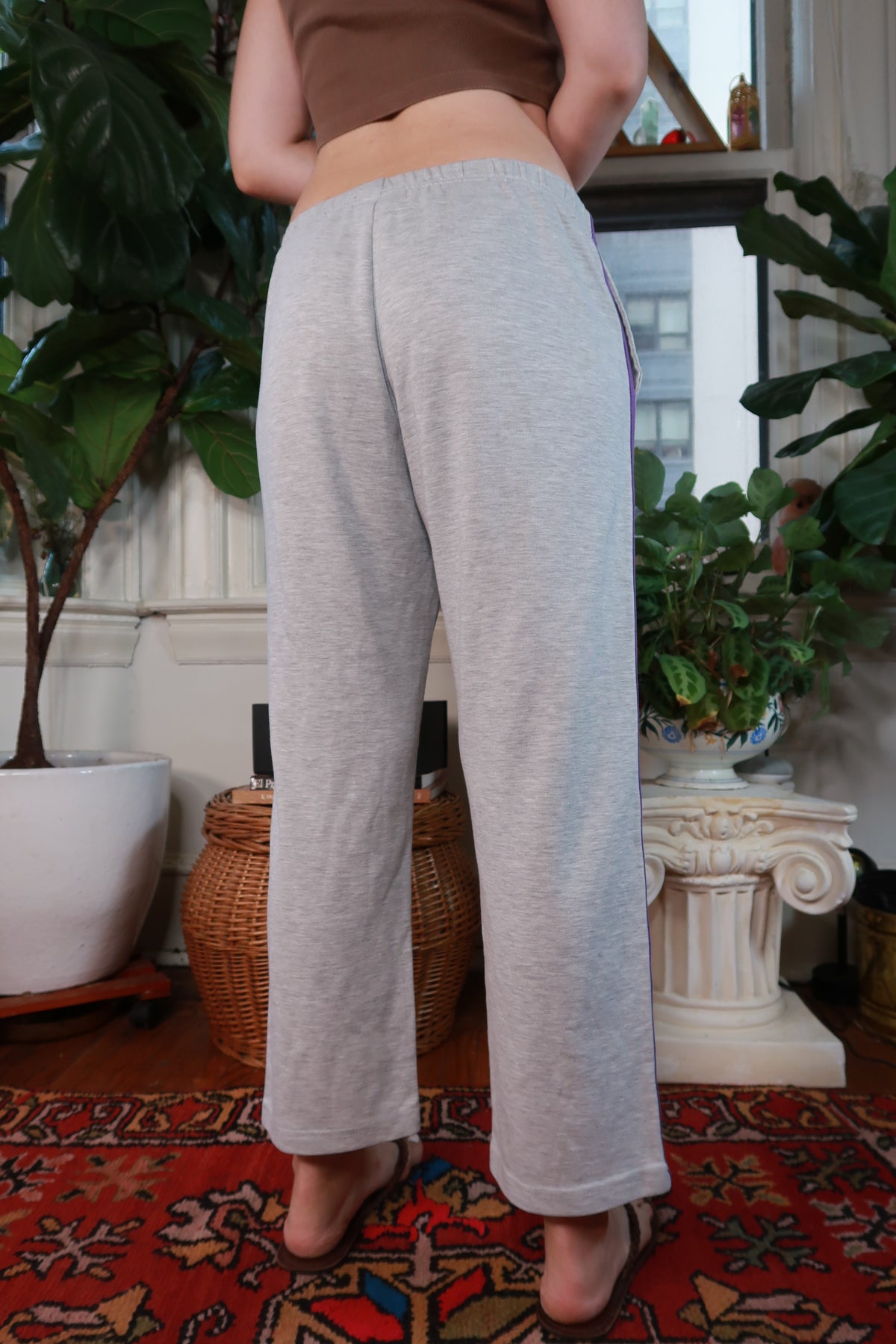 Vintage Y2K gray low rise wide leg track pants for women, featuring a relaxed fit and sporty style from Elektra Vintage.