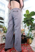 Load image into Gallery viewer, Gray wide-leg pants for women by Elektra Vintage, vintage 2000s Y2K style with low rise and double button waist.
