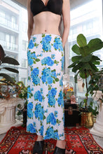 Load image into Gallery viewer, Vintage 2000s blue floral maxi skirt by Elektra Vintage, white and blue rose print, bias cut slip skirt, Y2K fashion style.
