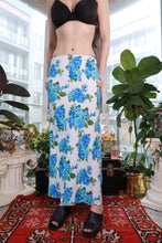 Load image into Gallery viewer, Vintage 2000s blue floral maxi skirt by Elektra Vintage, Y2K white and blue rose print bias cut slip skirt, flowing fabric.
