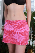 Load image into Gallery viewer, Pink floral mini skirt by Elektra Vintage, vintage 2000s Y2K low-rise bodycon style, showcasing a vibrant floral pattern.

