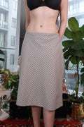Elektra Vintage neutral plaid midi skirt with bias cut and A-line silhouette, showcasing classic checkered pattern and vintage style.