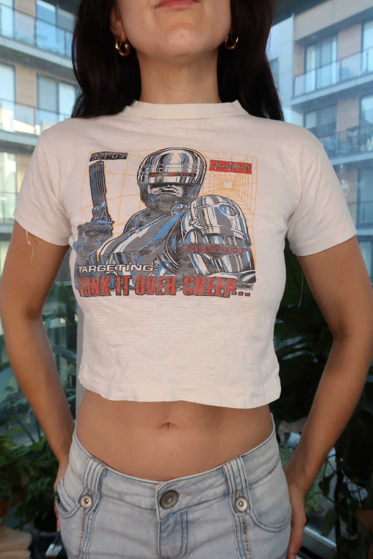 Vintage 90s RoboCop graphic baby tee for women by Elektra Vintage, featuring a retro RoboCop design on a soft, casual top.