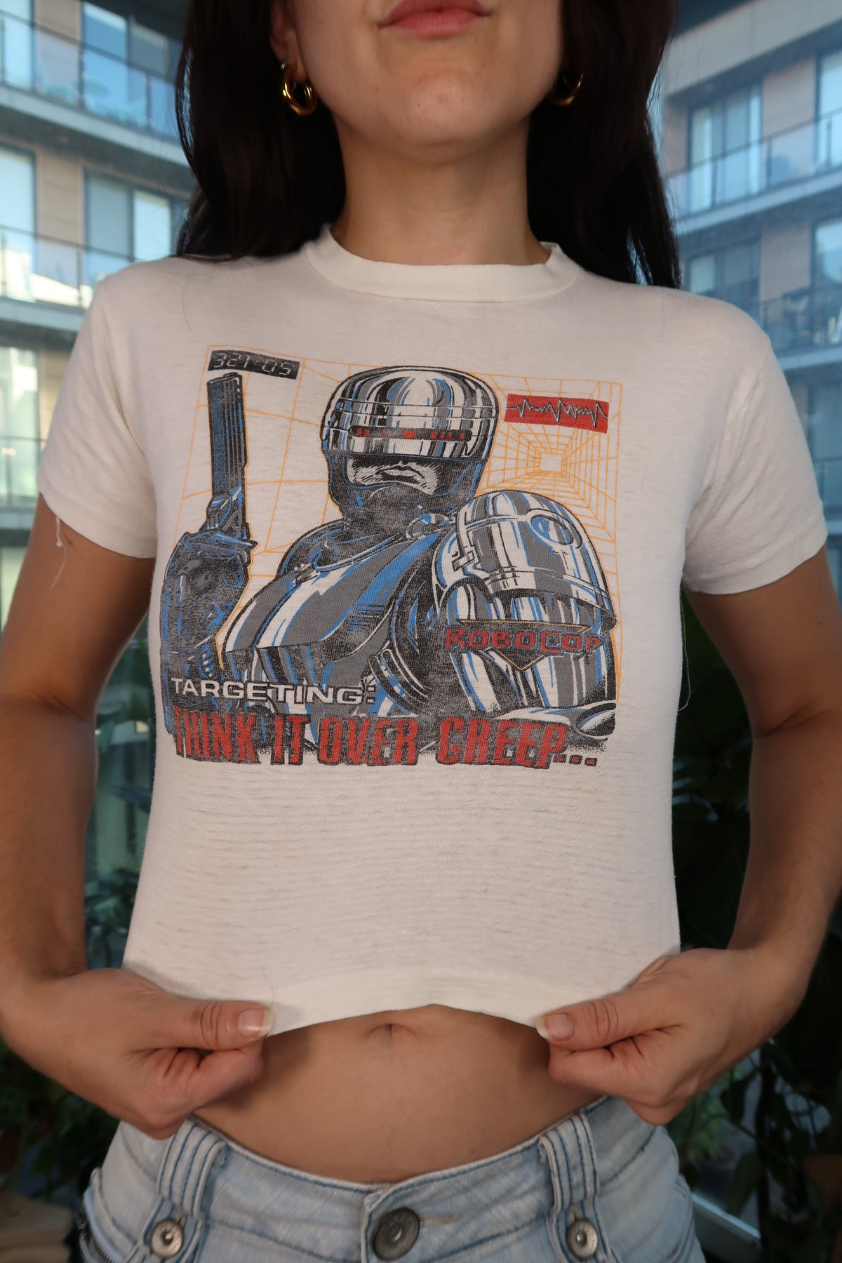 Vintage 90s RoboCop graphic baby tee for women, featuring retro sci-fi robot design by Elektra Vintage.