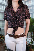 Women's vintage black sheer polka dot blouse with pink buttons, Y2K style, by Elektra Vintage, featuring a feminine button-up design.