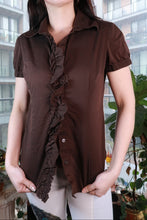 Load image into Gallery viewer, Chocolate brown vintage ruffle front button-up blouse for women by Elektra Vintage, featuring classic 2000s style and feminine details.
