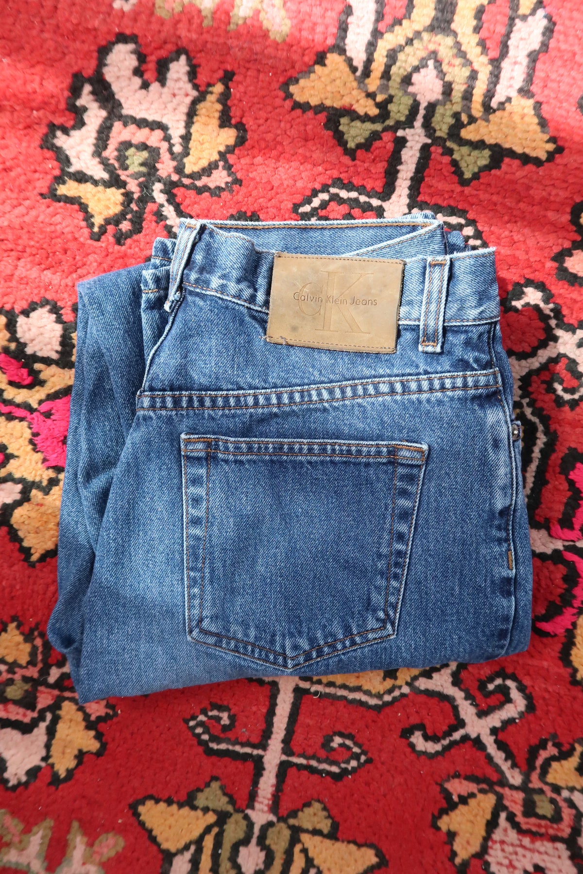 Men's vintage Calvin Klein classic straight leg jeans from Elektra Vintage, showing the denim fabric and fit.
