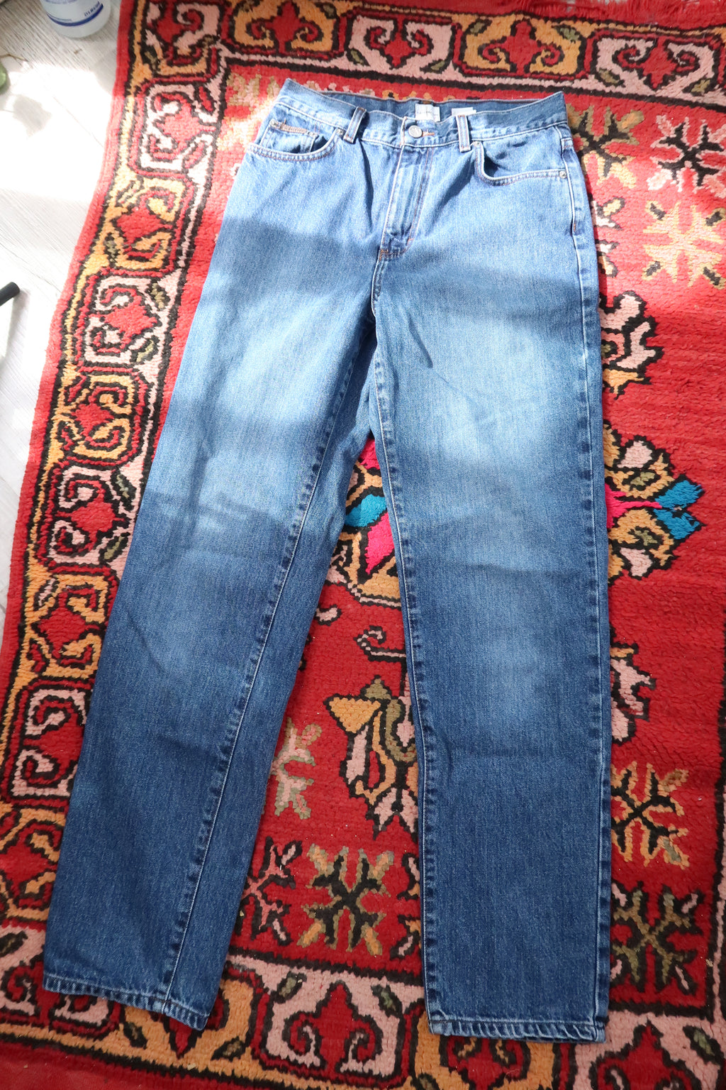 Men's vintage Calvin Klein straight leg jeans by Elektra Vintage, showcasing classic denim with a relaxed fit and timeless style.
