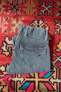 Vintage 2000s Old Navy women's pinstripe low-rise jeans with classic fit and denim texture, styled with a casual look.