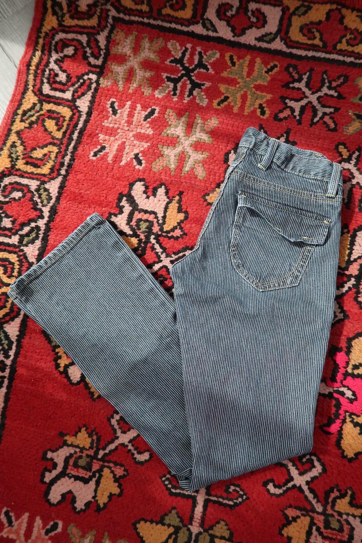 Women's vintage 2000s pinstripe low rise jeans by Old Navy, styled with a classic fit and faded denim look.