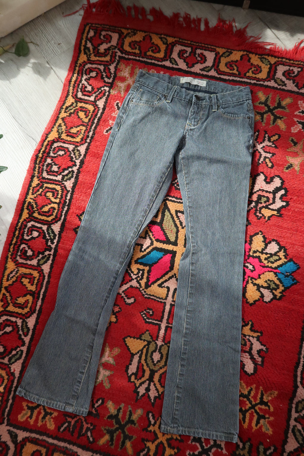 Vintage 2000s pinstripe low-rise jeans for women by Old Navy, styled with a classic fit and casual denim look.