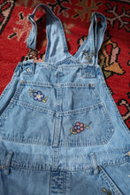 Load image into Gallery viewer, Vintage 1990s denim embroidered overall shorts dress by Elektra Vintage, featuring colorful embroidery and classic denim fabric.
