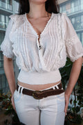 Vintage white lace peasant blouse by Elektra Vintage, boho smocked crop top with long sleeves and intricate lace details.