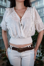 Load image into Gallery viewer, Vintage white lace peasant blouse by Elektra Vintage, boho smocked crop top with long sleeves and intricate lace details.

