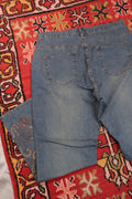 Women's vintage 2000s Y2K embroidered flare jeans by Elektra Vintage, featuring colorful embroidery and classic high-waisted style.